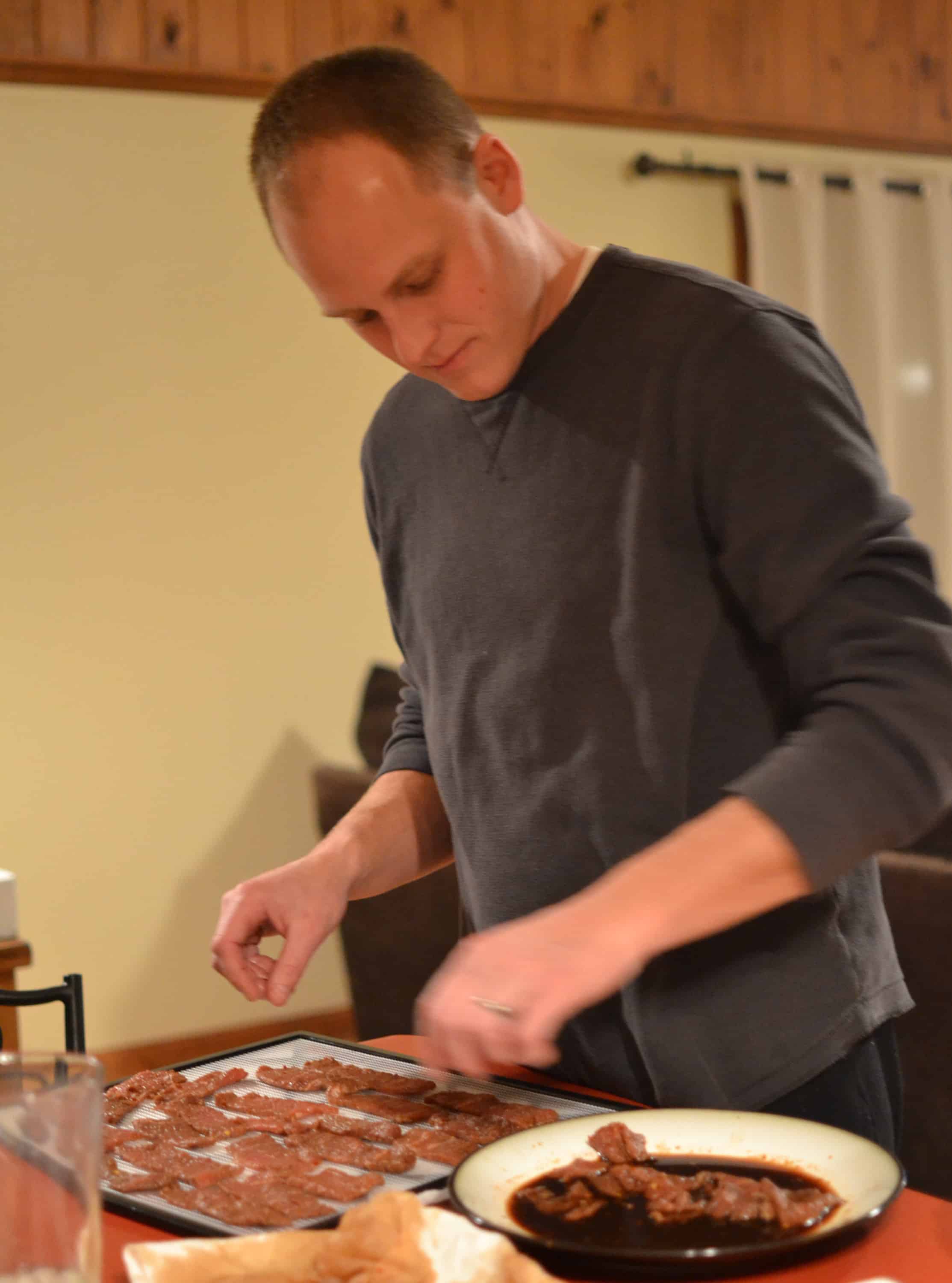 Thin slices of fresh meat are immersed in a flavorful marinade for several hours and then dehydrated or baked to create perfectly textured homemade beef jerky. Homemade beef jerky