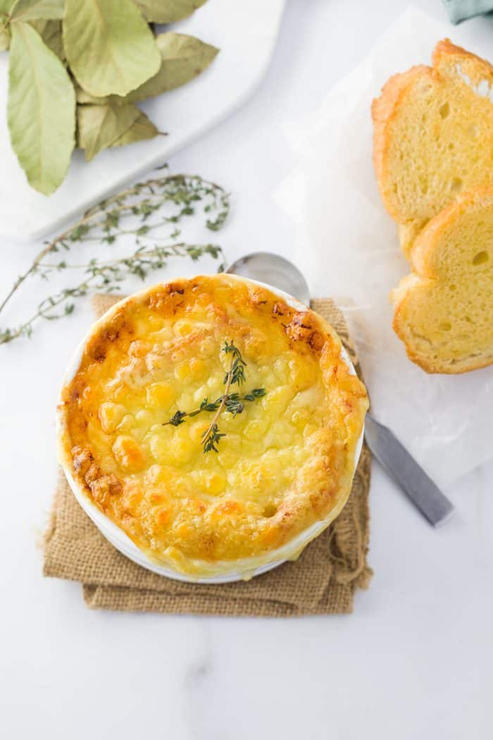 This instant pot french onion soup features perfectly caramelized onions in a rich, dark broth topped with a toasted baguette and hot and bubbly Gruyere cheese. Instant-Pot-French-Onion-Soup