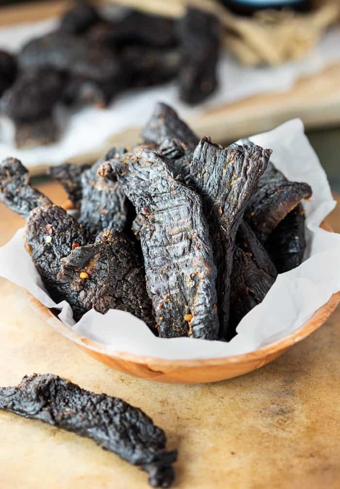 Thin slices of fresh meat are immersed in a flavorful marinade for several hours and then dehydrated or baked to create perfectly textured homemade beef jerky. Beef-Jerky-Recipe