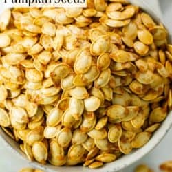 A labeled image of roasted pumpkin seeds in a white bowl.