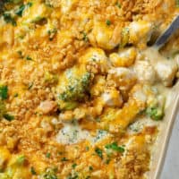 Chicken Divan in a baking dish with a crispy Ritz cracker topped, and chicken and broccoli in a cream sauce.