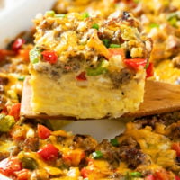 A slice of Hashbrown Breakfast Casserole on a wooden spatula.