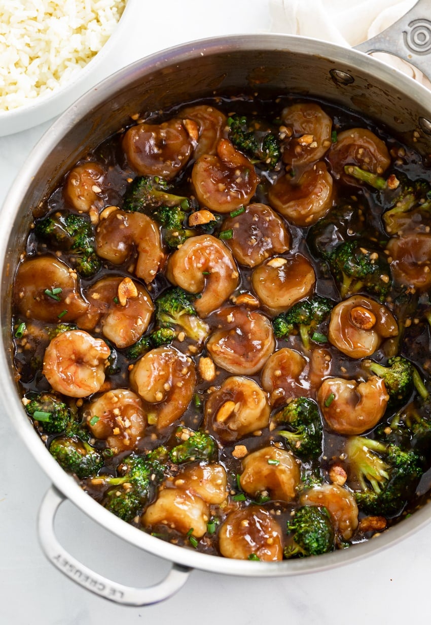 Honey Garlic Chicken in a skillet with a brown sauce and broccoli.