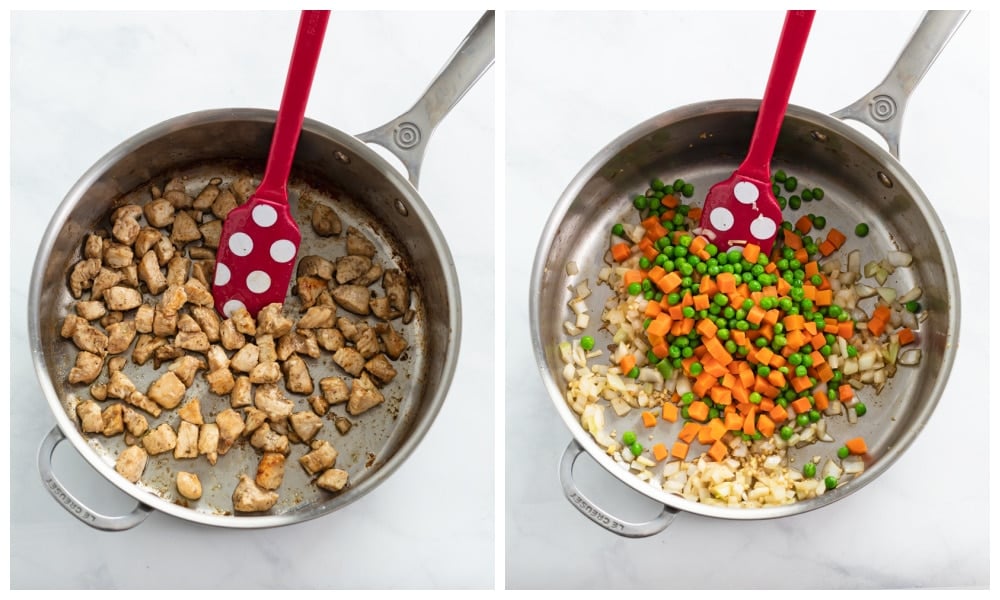 A skillet of cooked diced chicken next to a skillet of sauteed onions, carrots, and peas. 