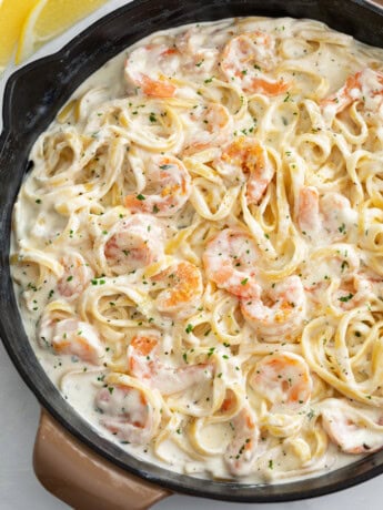 A skillet filled with Shrimp Alfredo with Fettucine.