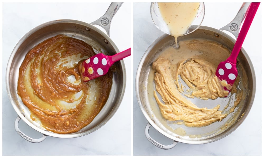 A skillet with a roux with gravy being stirred in.