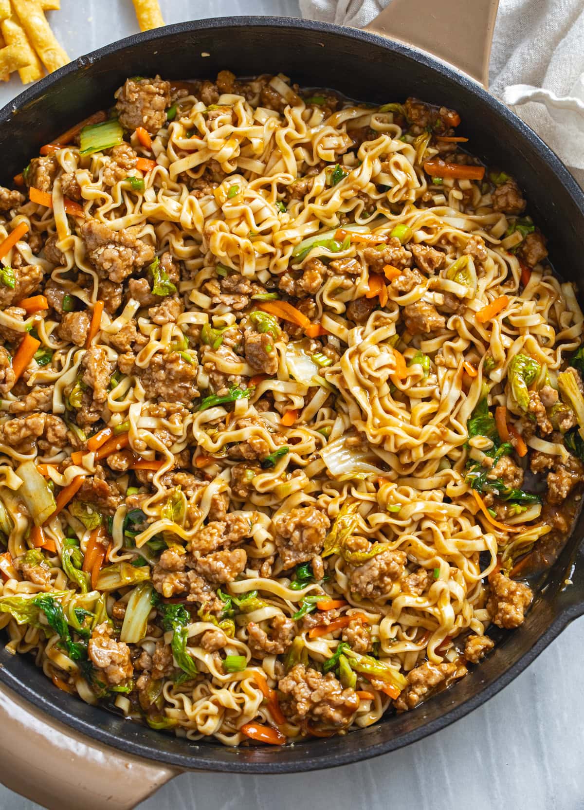 Pork Noodles with carrots and cabbage tossed in a homemade peanut sauce.